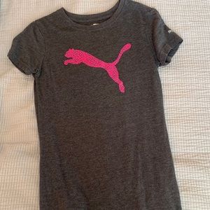 a dark gray Puma shirt